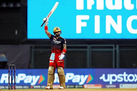 Virat Kohli of Royal Challengers Bangalore celebrates his fifty during T20 cricket match 67 of the Indian Premier League 2022. (Photo | PTI)