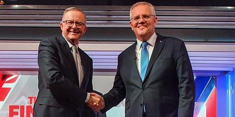 Australia PM Scott Morrison (R) and Australian opposition leader Anthony Albanese shake hands ahead of the leaders' debate in Sydney, Australia. (Photo | AP)