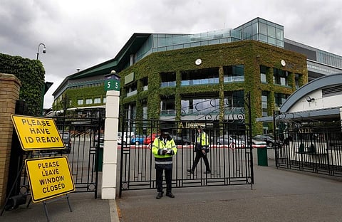 Security guards are shown at the gate in front of Centre Court at the All England Lawn Tennis Club. ( Photo | AP)