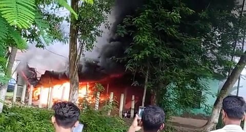 The mob, which also had women, barged into the Batadrava police station, vandalised it and beat up the personnel before torching the station. (Photo | Special Arrangement)