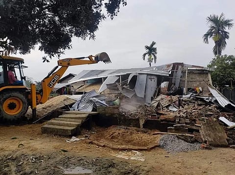 The houses of five persons who were allegedly involved in vandalizing Batadrava police station were razed to the ground by the administration with the use of bulldozers.
