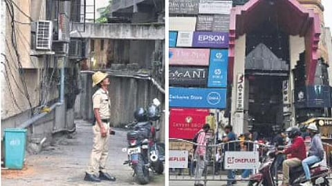 A policeman at the spot where the girl fell from the second floor of 5th Avenue Mall (right) on Brigade Road on Saturday | Shriram BN