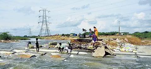 File photo of work to raise the banks by four metres at a cost of `15 crore | Express