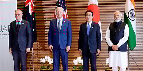 Leaders of Quad (L-R) Australian PM Anthony Albanese, US President Joe Biden, Japan PM Fumio Kishida, PM Narendra Modi pose for photo at the entrance hall of the PMO of Japan. (Photo | AP)