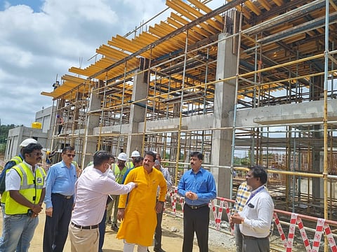 BDA Chairman S R Vishwanath (in orange) inspects works at KG Layout on Monday.