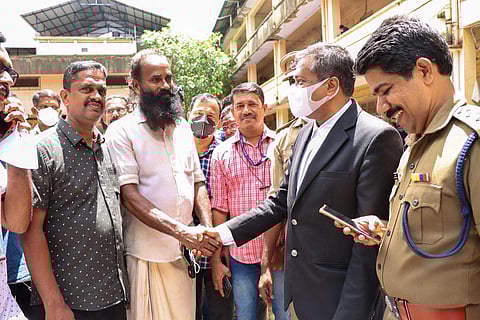 Vismaya’s father Thrivikraman Nair conveying his gratitude to prosecutor  G Mohanraj at Kollam Additional Sessions Court on Monday | Express