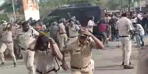 Police run away from agitators as they threw stones during their demand to let the district name as Konaseema. (Photo| EPS)