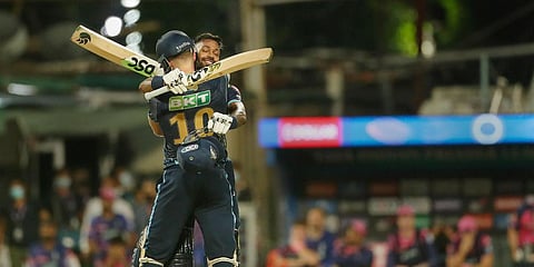 David Miller and Hardik Pandya of Gujarat Titans celebrate after winning Qualifier 1 match of IPL 2022 against Rajasthan Royals, at Eden Gardens in Kolkata. (Photo| PTI)