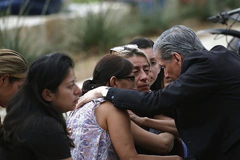 The archbishop of San Antonio, Gustavo Garcia-Siller, comforts families outside the Civic Center following a deadly school shooting at Robb Elementary School in Uvalde, Texas, Tuesday. (Photo | AP)