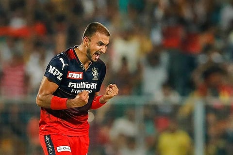 Harshal Patel of Royal Challengers Bangalore celebrates the wicket of Marcus Stoinis of Lucknow Super Giants. (Photo | PTI)