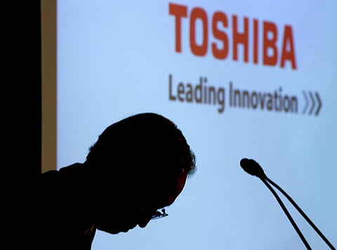 Japan's troubled Toshiba proposes outside directors to board