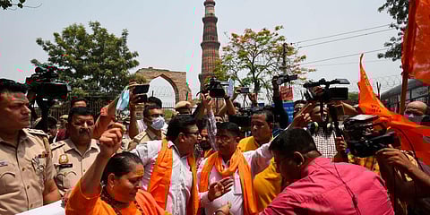 Members of right-wing organisations recite Hanuman Chalisa outside the Qutub Minar demanding to rename the monument as Vishnu Stambh, in New Delhi. (File photo| Shekhar Yadav, EPS)