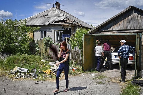 Residents remove debris from a destroyed house after Russian shelling in Kramatorsk, Ukraine, Wednesday, May 25, 2022. (Photo | AP)