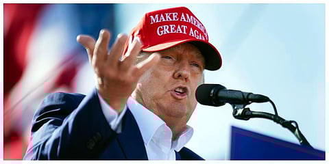 Former President Donald Trump speaks from the podium during a campaign rally, on May 1, 2022, in Greenwood. (Photo | AP)