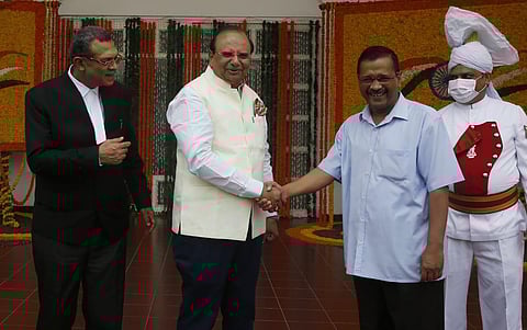 L-G Vinai Kumar Saxena and CM Arvind Kejriwal greets each other as Chief Justice of Delhi High Court Vipin Sanghi looks on during the ceremony on Thursday | Shekhar Yadav