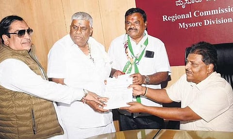 JDS South Graduates constituency candidate H K Ramu, accompanied by party  president C M Ibrahim and former minister H D Revanna, files his nomination papers in Mysuru on Thursday | Udayashankar S