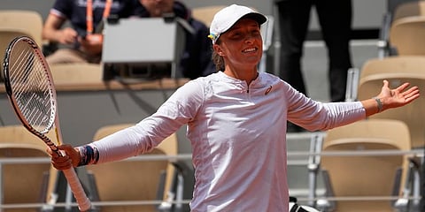 Iga Swiatek celebrates winning her third round match Danka Kovinic in two sets, 6-3, 7-5, at the French Open tennis tournament in Roland Garros stadium in Paris, France. (Photo | AP)