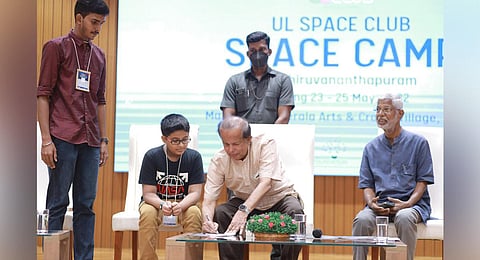 ISRO former chairman G Madhavan Nair interacts with children at the valedictory event of Kozhikode UL Space Club camp in Thiruvananthapuram on Wednesday.