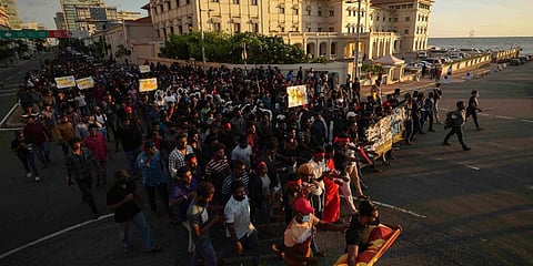 Sri Lankan university students march during a protest over the country’s worst economic crisis in decades outside the residence of prime minister Mahinda Rajapaksa in Colombo. (Photo | AP)