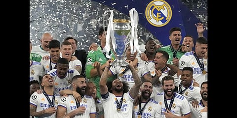 Real Madrid's Marcelo lifts the trophy as players celebrate winning the Champions League fina, at the Stade de France near Paris, Saturday, May 28, 2022.(Photo | AP)