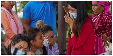 Family members and relatives of passengers on board the Twin Otter aircraft operated by Tara Air, weep outside the airport in Pokhara on May 29, 2022. (Photo | AFP)