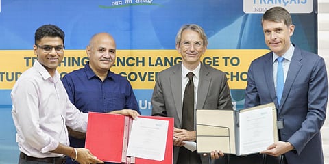 Deputy Chief Minister Manish Sisodia (2nd L) and Ambassador of France to India HE Emmanuel Lenain (2nd R) sign the MoU. (Photo| Twitter)