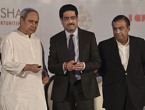 Naveen Patnaik with Kumar Mangalam Birla and Mukesh Ambani at the Make in Odisha conclave. (Photo | Special Arrangement)