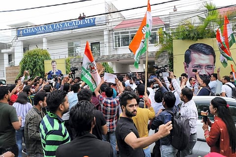 Activists of Indian Youth Congress shout slogans during their protest against the Punjab government over death of Punjabi singer Sidhu Moose Wala, in front of AAP office in Jammu. (Photo | PTI)