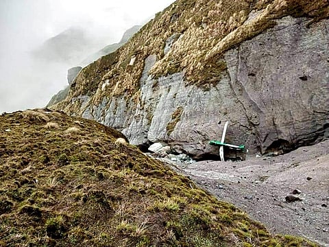 This handout photograph released by Fishtail Air, shows the wreckage of a plane in a gorge in Sanosware in Mustang district close to the mountain town of Jomsom. (Photo | AP)