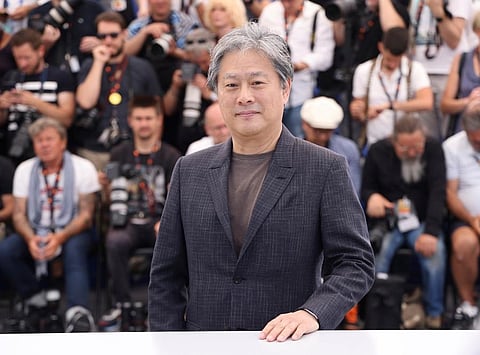 Director Park Chan-wook poses for photographers at the photo call for the film 'Decision to Leave' at the 75th international film festival, Cannes. (Photo | AP)