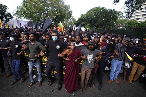 Anti government protesters march near the president's official residence in Colombo, Sri Lanka, Saturday, May 28, 2022. (Photo | AP)