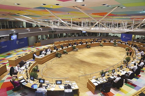 Ukrainian President Volodymyr Zelenskyy is seen on a screen, left, as addresses from Kyiv during an extraordinary meeting of EU leaders to discuss Ukraine, energy and food security(Photo | AP)
