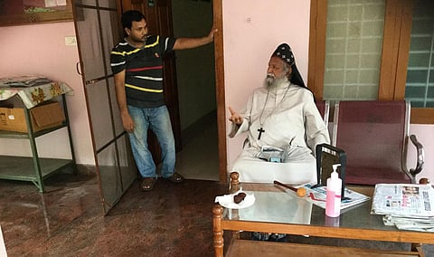 Joseph Mar Barnabas Suffragan Metropolitan of the Mar Thoma Church with cook Mohammed Kausal.