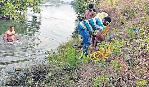 ASI Ajit Sarangi coming out of water after rescuing the teacher. (Photo | EPS)