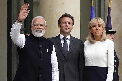 French President Emmanuel Macron, center, and his wife Brigitte Macron, right, welcome Indian Prime Minister Narendra Modi prior to a meeting at the Elysee palace in Paris(Photo| AP)