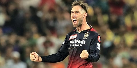 Glenn Maxwell of RCB celebrates the wicket of Ambati Rayudu of CSK during the IPL match at MCA International Stadium in Pune. (Photo | PTI)