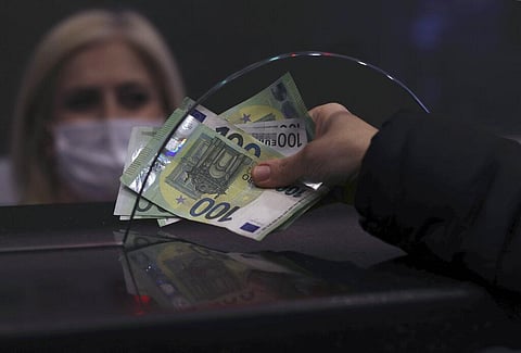 A woman changes Turkish lira for Euros at a currency exchange shop, in Ankara, Turkey. (File Photo | AP)