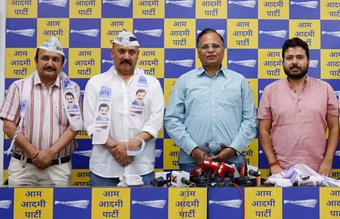 Arun Sharma and Sanjay Sharma joined the Aam Aadmi Party on Thursday in the presence of Delhi Health and Energy Minister Satyendar Jain. (Photo | Twitter/AamAadmiParty)