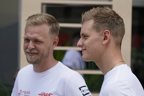 Haas driver Kevin Magnussen(L) with Haas driver Mick Schumacher. (Photo | AP)