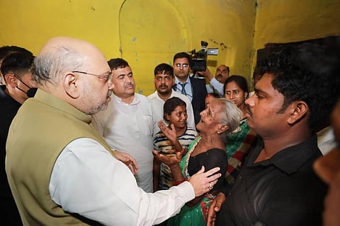Union Home Minister Amit Shah meets the family of BJP worker Arjun Chowrasia, in Kolkata, Friday, May 6, 2022.  (Photo | PTI)