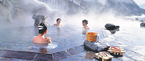 People enjoying a warm bath in one of the many onsens in Japan