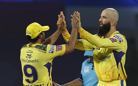 Moeen Ali of Chennai Super Kings celebrates with teammate Ambati Rayudu after a wicket during a match between CSK and delhi capitals on Sunday. (Photo | PTI)
