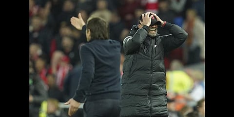 Liverpool's manager Jurgen Klopp, right, gestures during the EPL against Tottenham Hotspur at Anfield stadium May 7, 2022.(Photo | AP)