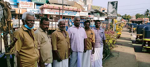 Autorickshaw drivers at the Neyyattinkara bus station junction.