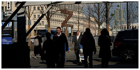 People walk along a street with a huge letter Z, which has become a symbol of the Russian military on a building in Moscow, Russia, Friday, May 6, 2022. (Photo | AP)