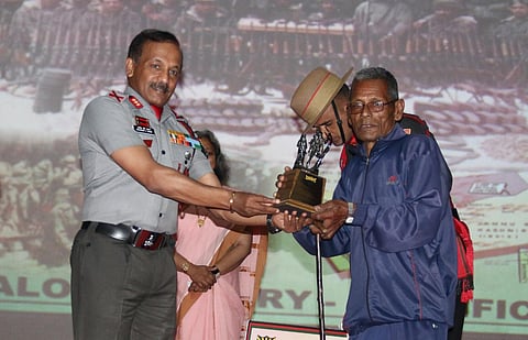 A surviving soldier being felicitated.