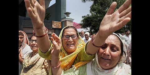 Relatives and family members of government teacher Rajni Bala mourn during her funeral, in Samba, Wednesday, June 1, 2022.(Photo | PTI)