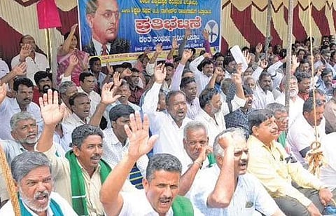 Members of DSS and other organisations protest against the textbook review committee, in Mysuru on Tuesday | Udayashankar S