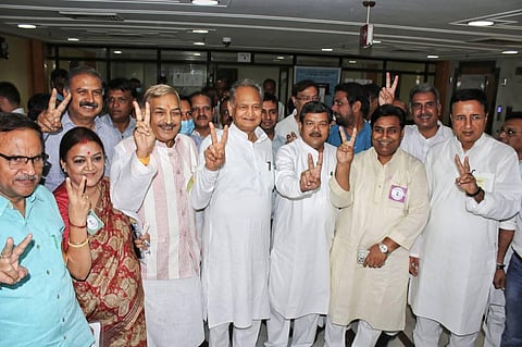 Rajasthan Chief Minister Ashok Gehlot with Congress candidate Pramod Tiwari, Mukul Wasnik and Randeep Surjewala and others flashes the victory sign during the Rajya Sabha election. (Photo | PTI)