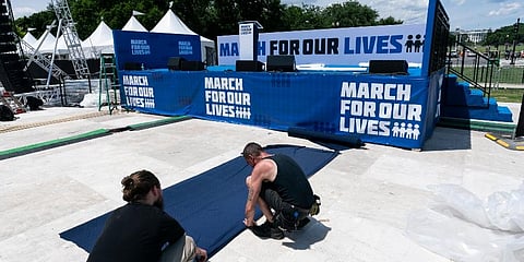 Workers set up for the March for Our Lives rally on the National Mall, near the White House, in Washington on Friday, June 10, 2022. (Photo | AP)